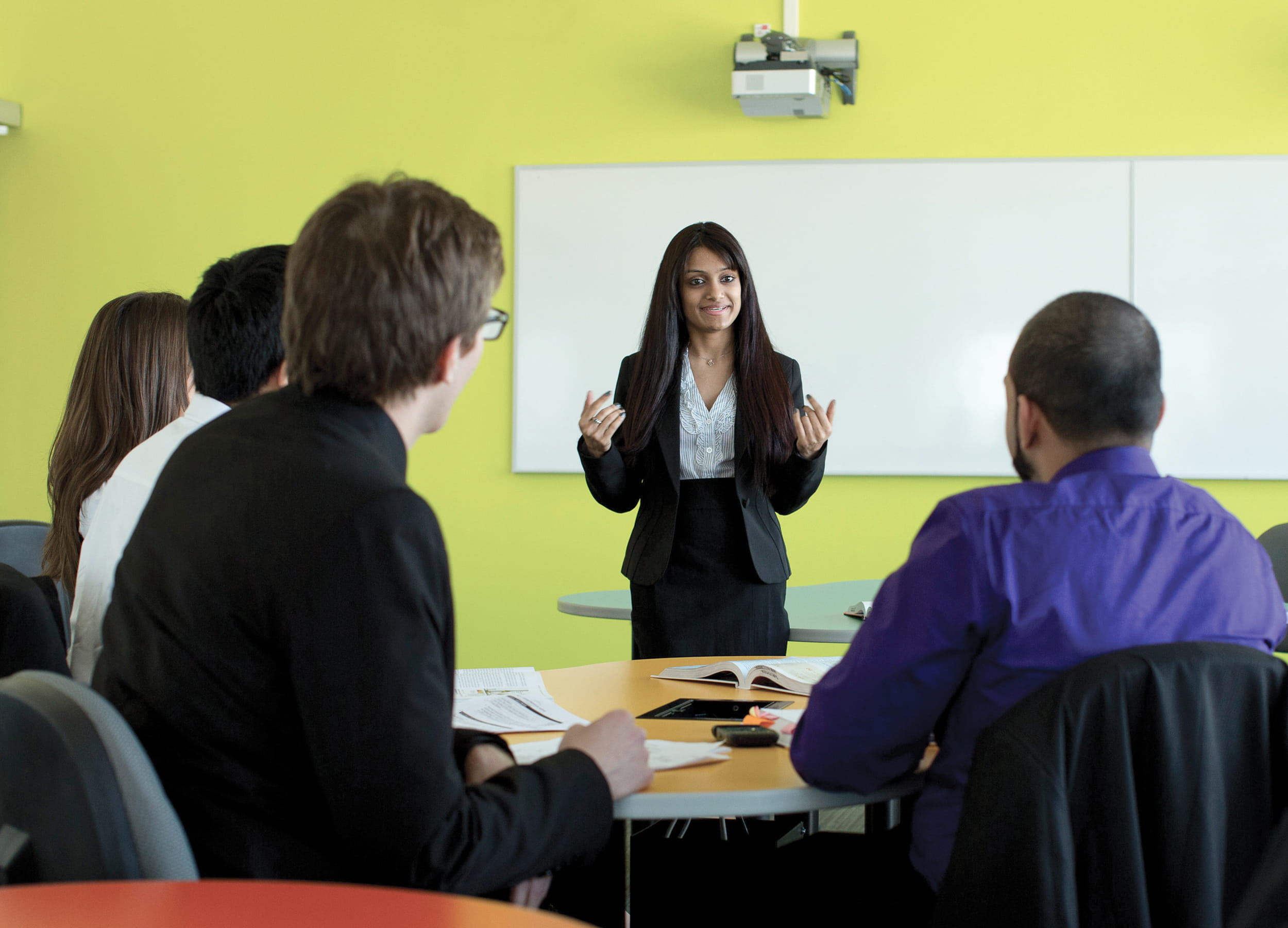 Business Administration instructor and students in a classroom